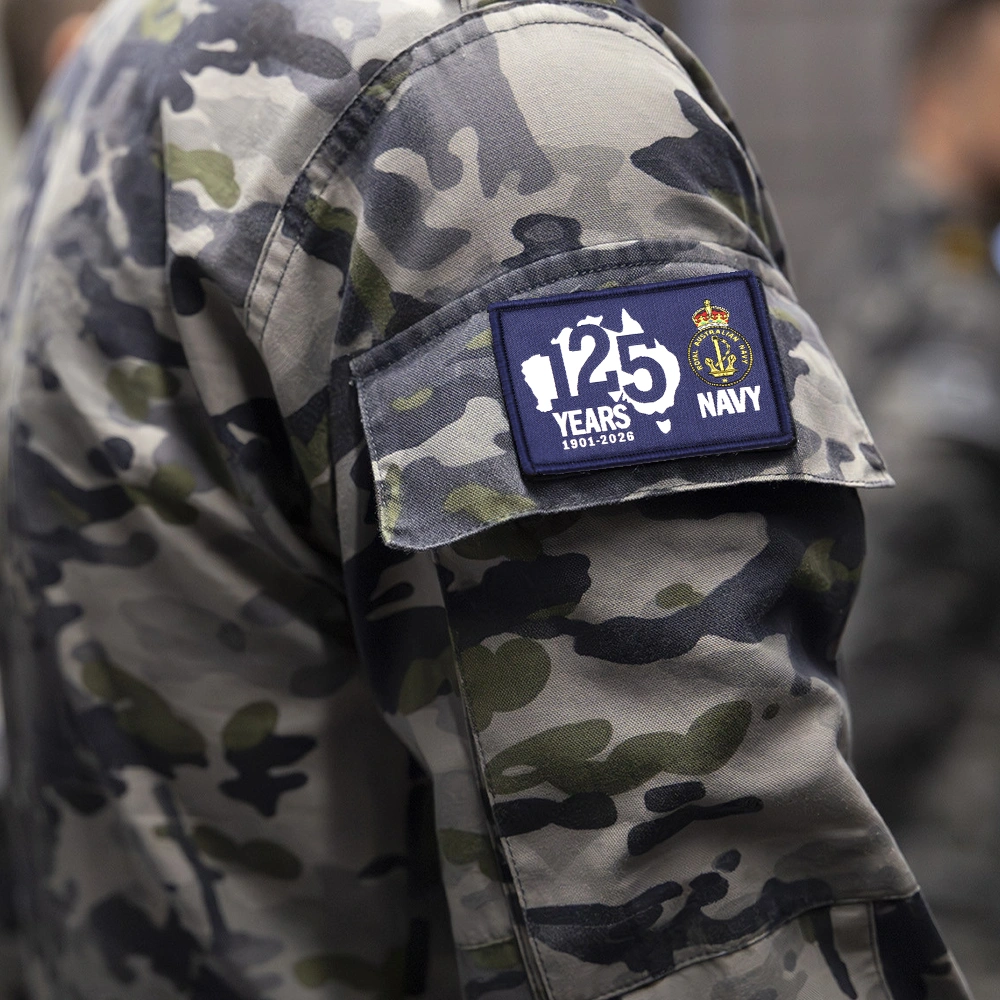 Royal Australian Navy 125th Anniversary Desk Paper Weight on a Desk